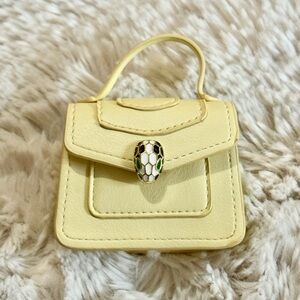 Elegant Cream Yellow Handbag with gold snake scale clasp